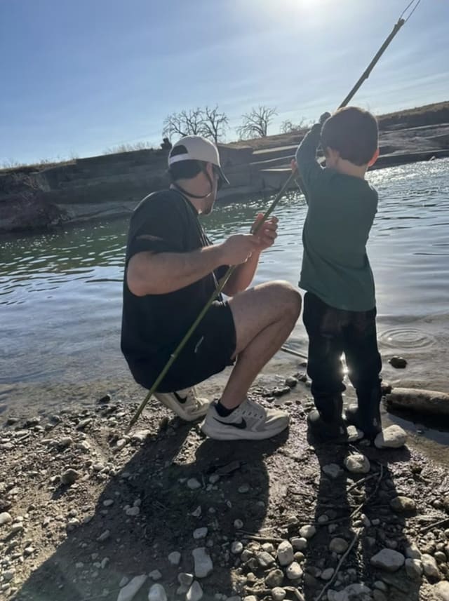 Preston fishing with their son on a Hill Country river